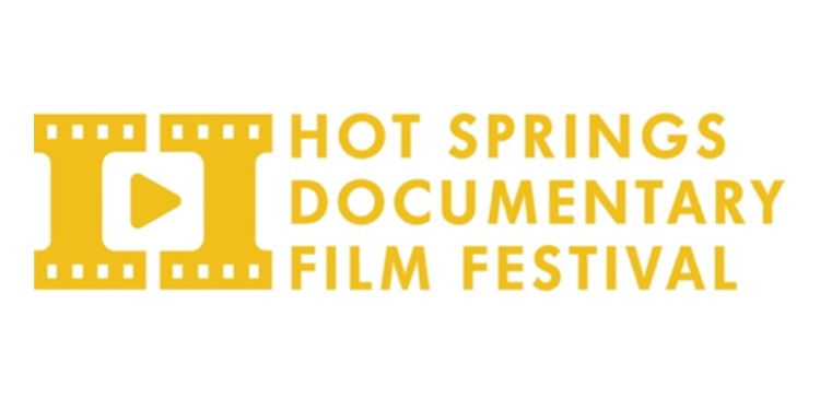 Logo for the Hot Springs Documentary Film Festival. It features a stylized yellow filmstrip shaped into the letter H with a play button in the center, followed by the words ‘Hot Springs Documentary Film Festival’ in bold yellow text